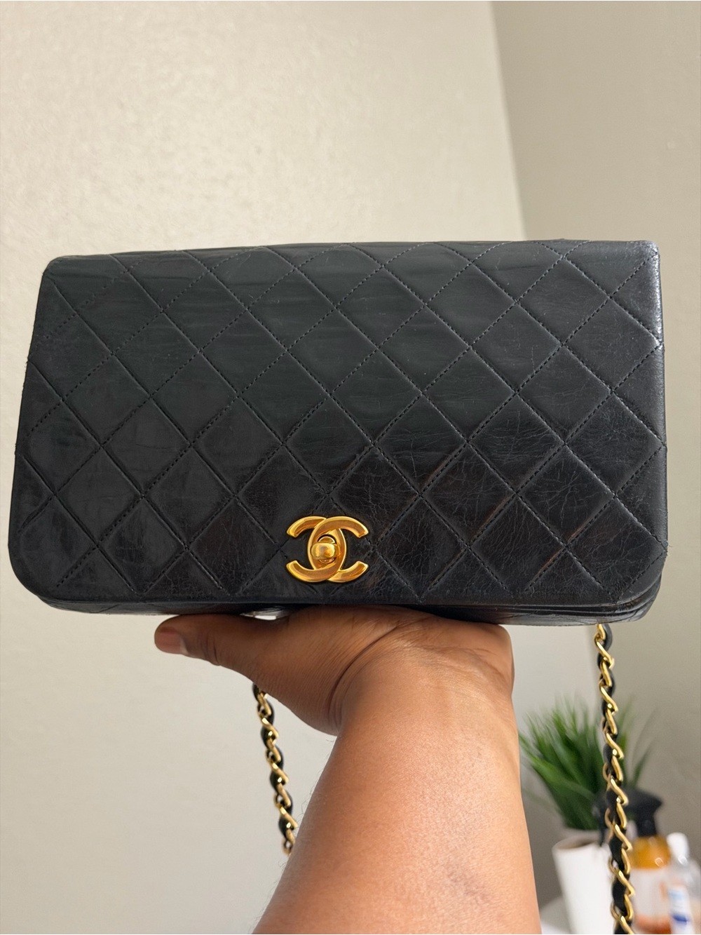 CHANEL Black Quilted Shoulder Bag with Gold CC Lock